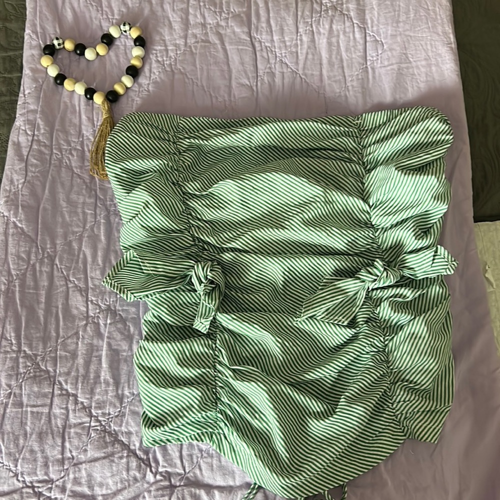 Green and white strapless blouse